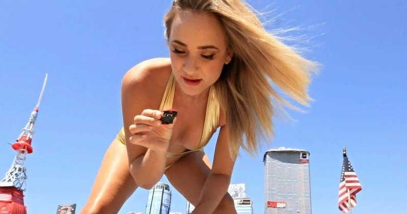 A man on the phone experiencing humiliation from a giantess